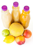 Fresh bottles of juice with fruits isolated on white