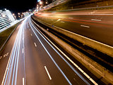 Long light trails from cars on a modern freeway