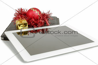gift white tablet with Christmas ball, box and red chain