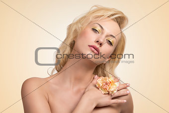 sensual blonde woman with flower