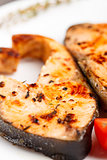 Salmon steak with thyme and pepper