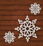 Set snowflakes on wooden background