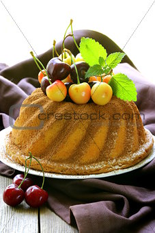 festive round sponge cake with berries cherry