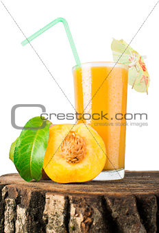 Peaches and glass with juice.