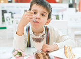Child eat milk choco shake