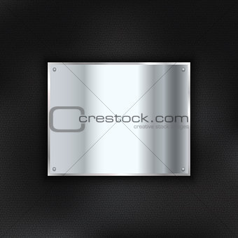 Metal plate on leather background