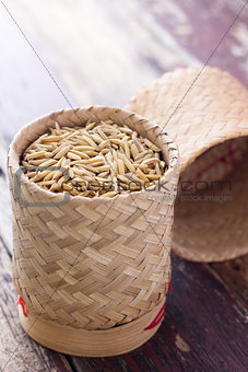 pile of unmilled paddy grains in bamboo basket