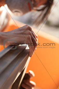 Woman polishing a window with sand
