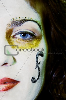 girl's face with painted clef