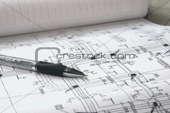 pen and architectural plans close up