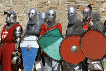 several knights on stone wall background