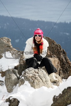 Girl in winter mountains