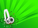 Musical headphones on green background