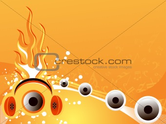 stereo headphone and speakers on flame background