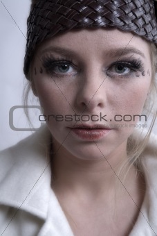 Stylish portrait of a blond girl with soft skin