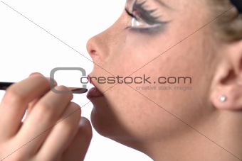 Make up artist applying lipstick