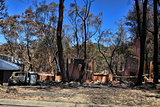 After the fire - burned houses and vehicles