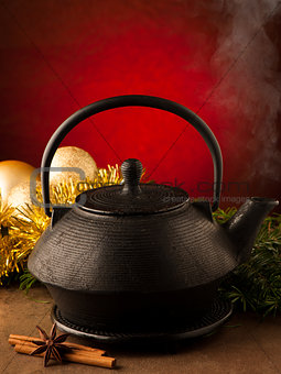 Christmas tea in old iron teapot