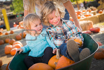 Young Family Enjoys a Day at the Pumpkin Patch