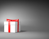 White Gift Box with Red Ribbon and Bow on the Gray Background