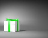 White Gift Box with Green Ribbon and Bow on the Gray Background