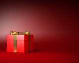 Red Gift Box with Gold Ribbon and Bow on the Red Background