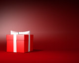 Red Gift Box with White Ribbon and Bow on the Red Background