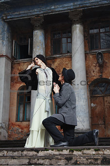 Retro styled fashion portrait of a young couple. Clothing and ma