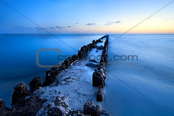 long old wooden dike in North sea