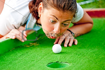 Girl cheating in the game of golf