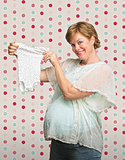Expecting Mother with Baby Clothes