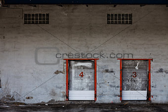 Old Grungy Industrial Garage Door with Graffitis.