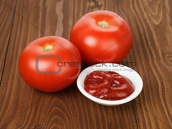 tomato sauce in bowl on wooden table