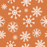 White snowflakes on brown background