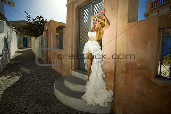 The beautiful bride in a wedding dress on Santorini in Greece.