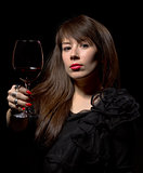 Young woman with red wine from a glass