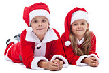 Kids in santa costumes at christmas time