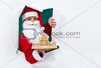 Santa giving you a gingerbread cookie house