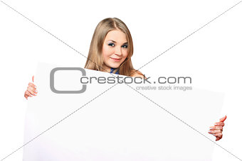 Cheerful young woman posing with white board
