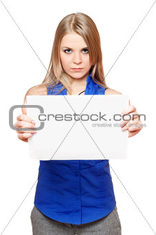 Serious young blonde holding empty white board