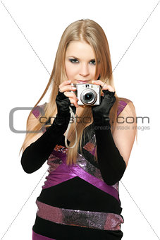 Young beautiful blonde holding a photo camera. Isolated