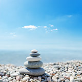 stack of zen stones over sea and clouds background