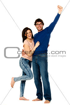Beautiful couple cheering and celebrating isolated on a white ba