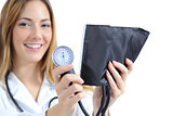 Female doctor holding and showing a sphygmomanometer