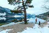 Alpine winter lake view and family.