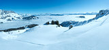 Cloudy winter mountain panorama. Ski resort. All people are not 