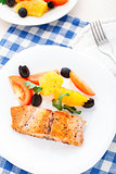 Salmon with oranges, tomatoes and olives