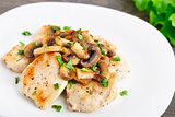 Fried chicken fillet with mushrooms