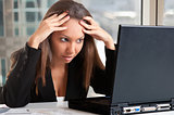 Worried Woman Looking At A Computer Monitor