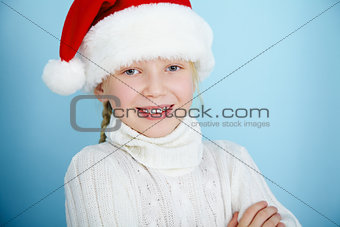 Smiling girl in Santa hat